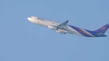 PHUKET, THAILAND NOVEMBER 13, 2019 - Thai Airways Airbus A330 HS TET departure from Phuket airport. View from Nai Yang beach video