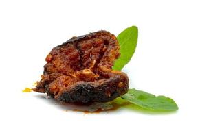 Stir Fried Crispy Catfish with Curry and leaf  fresh basil isolated on white background photo