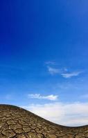 Large field of baked earth after a long drought photo