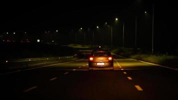 white car in night on Highway road photo