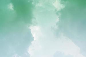 White cloud and green sky background with copy space photo