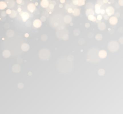 Golden bokeh lights with glowing particles isolated.