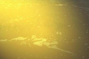 Shiny gold beach texture,abstract background,golden pattern photo