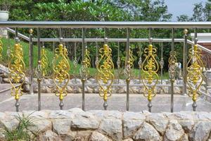 stainless fence with ornament of gold photo
