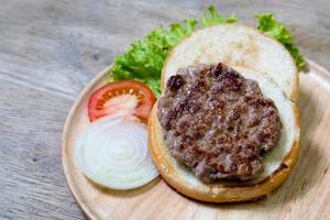 pork burger on wooden dish,homemade photo