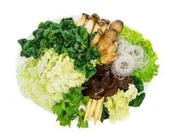 various fresh vegetables for sukiyaki on white dish, isolated on white background,top view photo