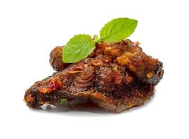 Stir Fried Crispy Catfish with Curry and leaf  fresh basil isolated on white background photo