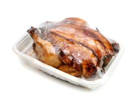 roasting chicken in plastic packaging,isolated on white background photo