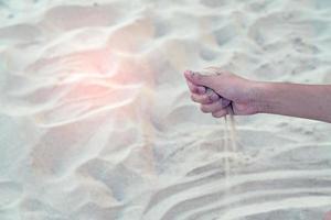 Sand in hand with sandy floor background photo