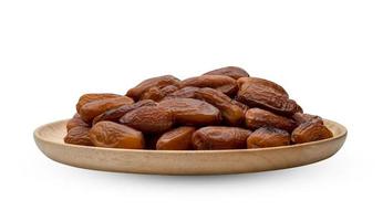 dry dates palm in wooden bowl isolated on white background ,include clipping path photo