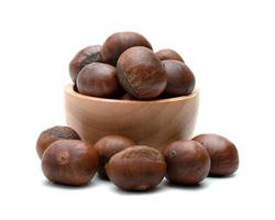 peeled roasted chestnut in wooden bowl isolated on white background photo