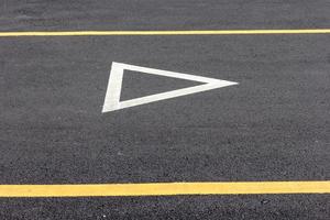 Give way sign on asphalt road photo