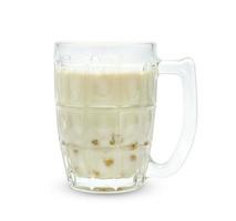 soybean milk and bubble foam in transparent glass isolated on white background ,include clipping path photo