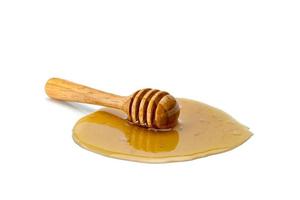 wooden honey dipper isolated on white background photo