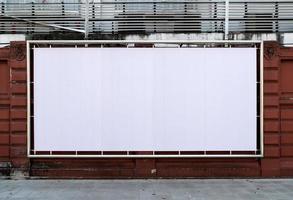 white billboards hanging on wall photo