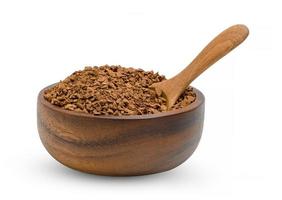 Instant coffee powder with wooden spoon and bowl isolated on white background photo