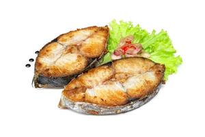 King mackerel or spotted mackerels steak isolated on white background ,fried Scomberomorus fish photo