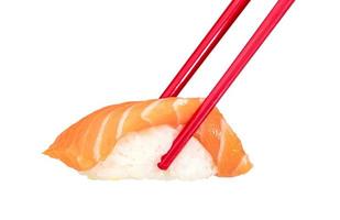 Salmon sushi nigiri with red chopsticks isolated on white background, Japanese food photo