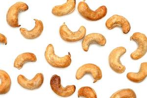 fried cashew nuts isolated on white background photo