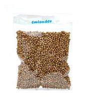 dried coriander seeds in clear plastic bag isolated on white background ,top view photo