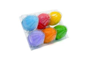 colorful eggs in the  plastic package box isolated on white background