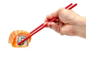 rolled sushi salmon nigiri with red chopsticks isolated on white background, Japanese food photo