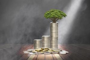 coins stack with lighting and smoke on wooden stage,economic growth concept photo