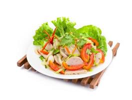 Thai cuisine spicy pork salad on white background or Yum Moo Yor,Spicy Vietnamese Sausage photo