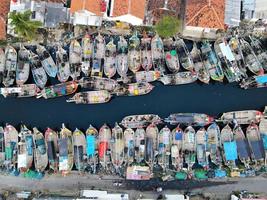 Beautiful aerial views, natural panorama of boats lined up in a fishing village -Indonesia. photo