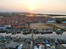 Beautiful aerial views, natural panorama of boats lined up in a fishing village -Indonesia. photo