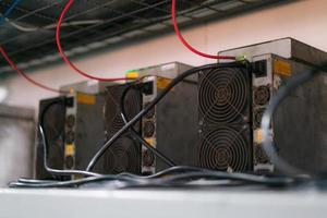 ASIC mining equipment for cryptocurrency on steel container.  Bitcoin miners in farm. photo