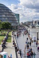LONDON, UK - AUGUST 22. View of City Hall and the promenade in London on August 22, 2014. Unidentified people photo