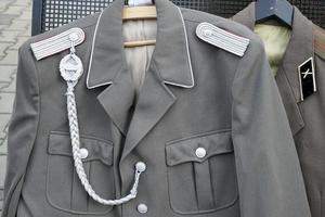 Berlin Germany, 2014. Second World War uniforms for sale at Checkpoint Charlie in Berlin photo