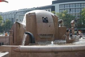 Berlin, Germany - September 15, 2014. View of J Schmettan's globe fountain in Berlin on September 15, 2014. Unidentified people photo