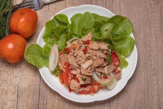 Spicy Tuna Salad in white plate photo