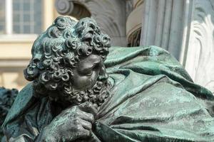 Berlin, Germany, 2014. One of the four chained warriors at the base of King Frederic the Great statue Charlottenburg Palace in Berlin photo