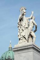 Berlin, Germany, 2014. Statue of Young man led to a new battle by Athena on the Castle bridge in Berlin photo