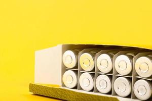 Bubbles, ampoules with dry probiotic, bifidobacteria, with probiotic powder inside on a yellow background. Copy space. photo