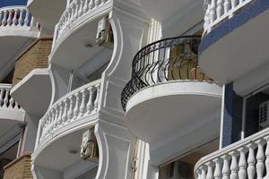 Facade of a modern building with balconies in a European resort. Close-up. photo