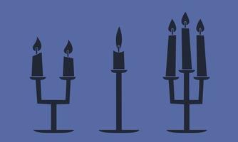 Set of candelabras with candles. Halloween design elements in black flat style. vector