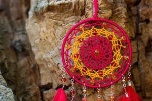 Handmade dream catcher with feathers threads and beads rope hanging photo