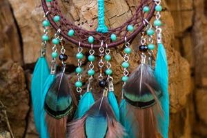 Handmade dream catcher with feathers threads and beads rope hanging photo