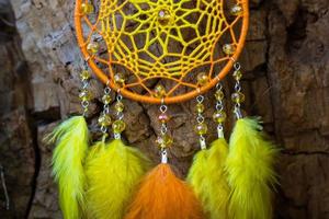 Handmade dream catcher with feathers threads and beads rope hanging photo