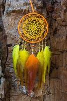 Handmade dream catcher with feathers threads and beads rope hanging photo
