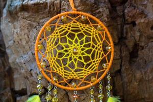 Handmade dream catcher with feathers threads and beads rope hanging photo