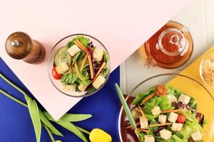 Green Lettuce Salad with Tomato, Cucumber, Carrot, and Croutons photo