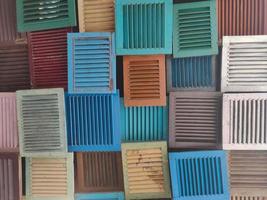 shutters made of wood and arranged in various colors into a background photo