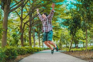 asian man drinking coffee with natural scenery photo