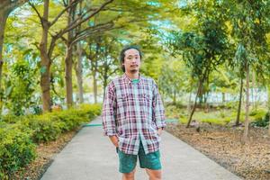 asian man drinking coffee with natural scenery photo