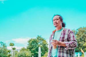 asian man drinking coffee with natural scenery photo